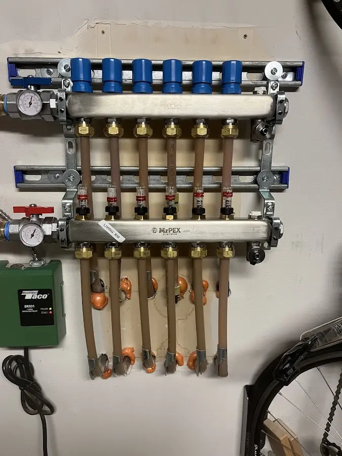 Plumber performing Water Heater Repair at a residential property in Rochester